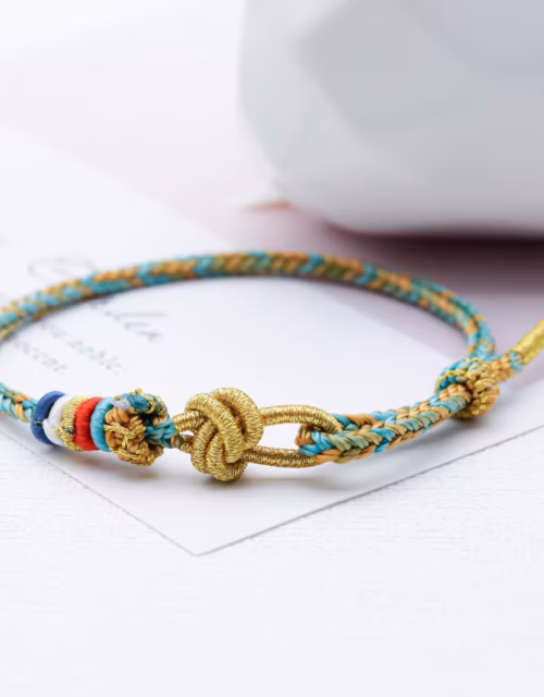 Buddhist Lucky Knot Bracelet - Turquoise and Gold Braided Design
